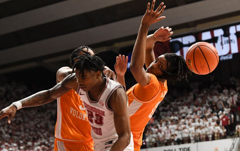 Mar 2, 2024; Tuscaloosa, Alabama, USA;  Tennessee guard Joshia-Jordan James (30), Tennessee forward Jonas Aiddo (0), and Alabama forward Nick Pringle (23) battle for a rebound at Coleman Coliseum. Mandatory Credit: Gary Cosby Jr.-USA TODAY Sports