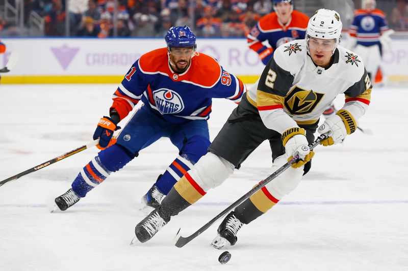 Nov 28, 2023; Edmonton, Alberta, CAN; Vegas Golden Knights defensemen Zach Whitecloud (2) tires to clear the puck ins front of Edmonton Oilers forward Evander Kane (91)  during the first period at Rogers Place. Mandatory Credit: Perry Nelson-USA TODAY Sports