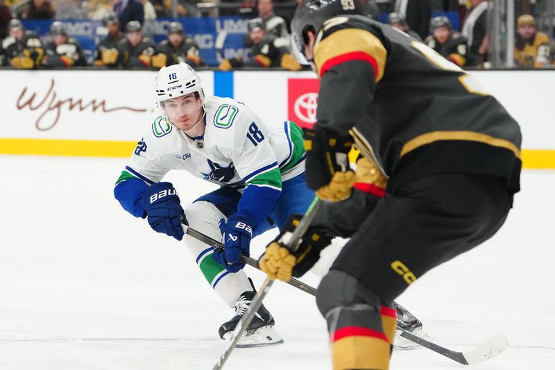 Feb 4, 2026; Las Vegas, Nevada, USA; Vancouver Canucks left wing Drew O'Connor (18) covers Vegas Golden Knights right wing Mitch Marner (93) during the first period at T-Mobile Arena. Mandatory Credit: Stephen R. Sylvanie-Imagn Images