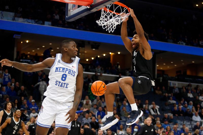 Jan 31, 2024; Memphis, Tennessee, USA; Rice Owls guard Anthony Selden (4) dunks during the second half against the Memphis Tigers at FedExForum. Mandatory Credit: Petre Thomas-USA TODAY Sports