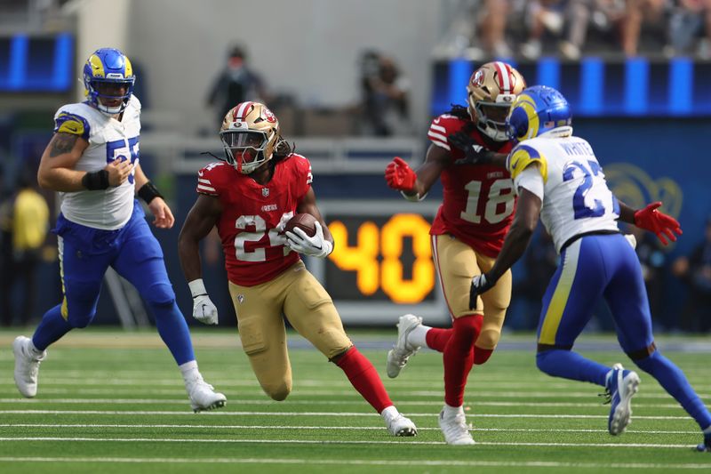 San Francisco 49ers running back Jordan Mason (24) runs against the Los Angeles Rams during the second half of an NFL football game, Sunday, Sept. 22, 2024, in Inglewood, Calif. (AP Photo/Ryan Sun)