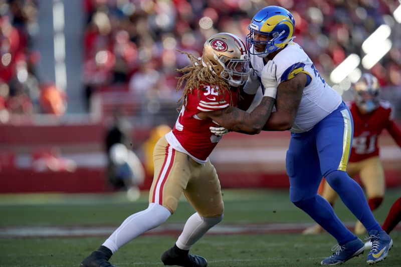 San Francisco 49ers defensive end Chase Young (92) fights through Los Angeles Rams offensive tackle Alaric Jackson (77) during an NFL football game, Monday, Jan. 7, 2024, in Santa Clara, Calif. (AP Photo/Scot Tucker)