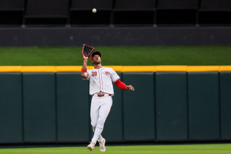 May 26, 2024; Cincinnati, Ohio, USA; Cincinnati Reds outfielder Will Benson (30) catches a pop up hit by Los Angeles Dodgers second baseman Gavin Lux (not pictured) in the fifth inning at Great American Ball Park. Mandatory Credit: Katie Stratman-USA TODAY Sports