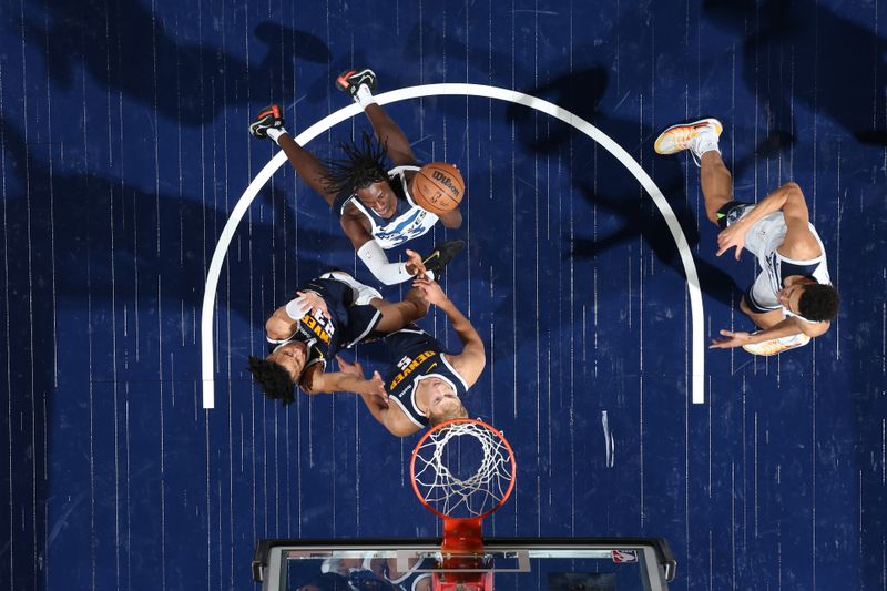 MINNEAPOLIS, MN -  OCTOBER 17: Leonard Miller #33 of the Minnesota Timberwolves drives to the basket during the game against the Denver Nuggets during the 2024 NBA Preseason on October 17, 2024 at Target Center in Minneapolis, Minnesota. NOTE TO USER: User expressly acknowledges and agrees that, by downloading and or using this Photograph, user is consenting to the terms and conditions of the Getty Images License Agreement. Mandatory Copyright Notice: Copyright 2024 NBAE (Photo by David Sherman/NBAE via Getty Images)