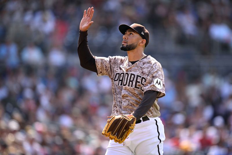 Jul 30, 2023; San Diego, California, USA; San Diego Padres relief pitcher Robert Suarez (75) gestures after the last out of the top of the eighth inning was recorded against the Texas Rangers at Petco Park. Mandatory Credit: Orlando Ramirez-USA TODAY Sports