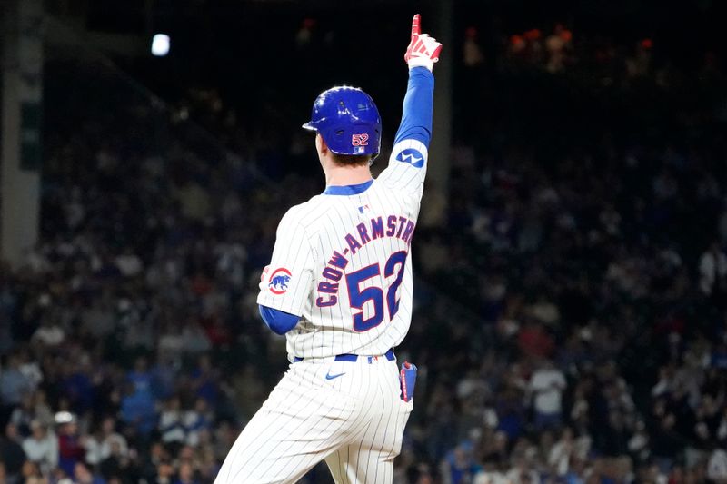 Aug 6, 2024; Chicago, Illinois, USA; Chicago Cubs outfielder Pete Crow-Armstrong (52) gestures after hitting a one run single against the Minnesota Twins during the eighth inning at Wrigley Field. Mandatory Credit: David Banks-USA TODAY Sports