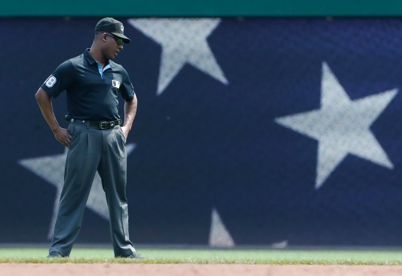 Aug 4, 2024; Pittsburgh, Pennsylvania, USA;  Second base umpire Ramon DeJesus (18) in the field during the third inning between the Arizona Diamondbacks and the Pittsburgh Pirates at PNC Park. Mandatory Credit: Charles LeClaire-USA TODAY Sports