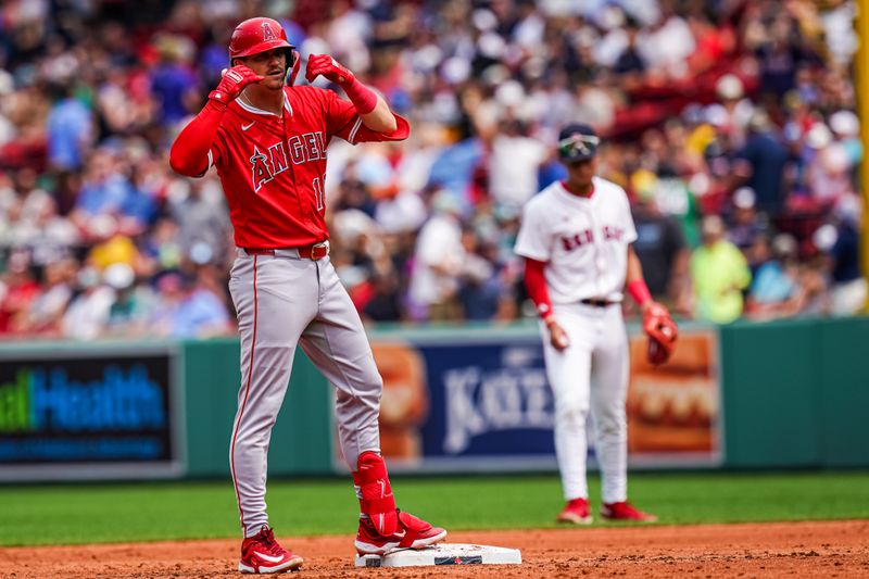 Jun 4, 2025; Boston, Massachusetts, USA; Los Angeles Angels third base Kevin Newman (10) hits a ground rule double against the Boston Red Sox in the second inning at Fenway Park. Mandatory Credit: David Butler II-Imagn Images