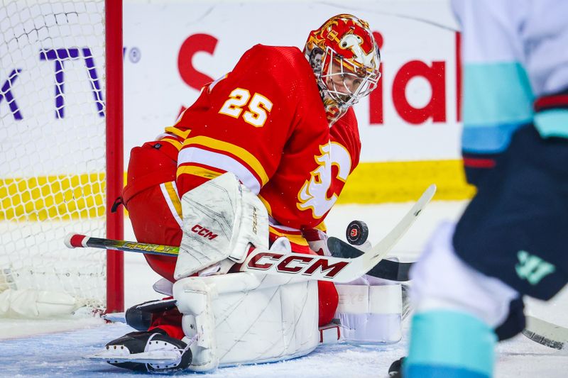 Mar 4, 2024; Calgary, Alberta, CAN; Calgary Flames goaltender Jacob Markstrom (25) makes a save against the Seattle Kraken during the first period at Scotiabank Saddledome. Mandatory Credit: Sergei Belski-USA TODAY Sports