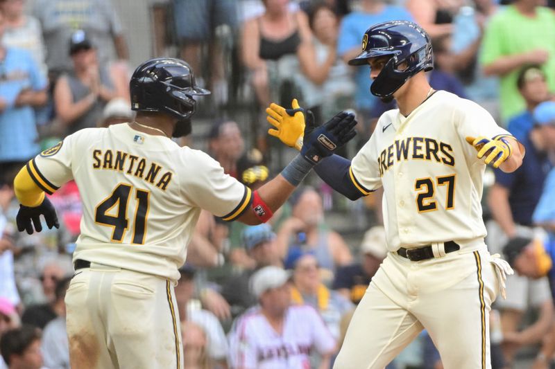 Aug 23, 2023; Milwaukee, Wisconsin, USA; Milwaukee Brewers shortstop Willy Adames (27) celebrates with first baseman Carlos Santana (41) after hitting a two run home run in the sixth inning against the Minnesota Twinsat American Family Field. Mandatory Credit: Benny Sieu-USA TODAY Sports