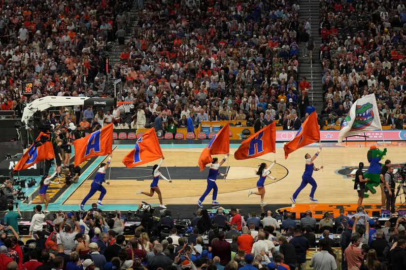 Apr 5, 2025; San Antonio, TX, USA; The Florida Gators cheerleaders take the court before the game in the semifinals of the men's Final Four of the 2025 NCAA Tournament at Alamodome. Mandatory Credit: Scott Wachter-Imagn Images