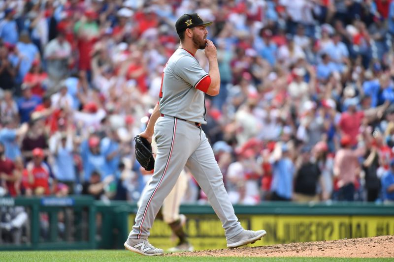 May 19, 2024; Philadelphia, Pennsylvania, USA; Washington Nationals pitcher Tanner Rainey (21) reacts after allowing home run against the Philadelphia Phillies during the eighth inning at Citizens Bank Park. Mandatory Credit: Eric Hartline-USA TODAY Sports