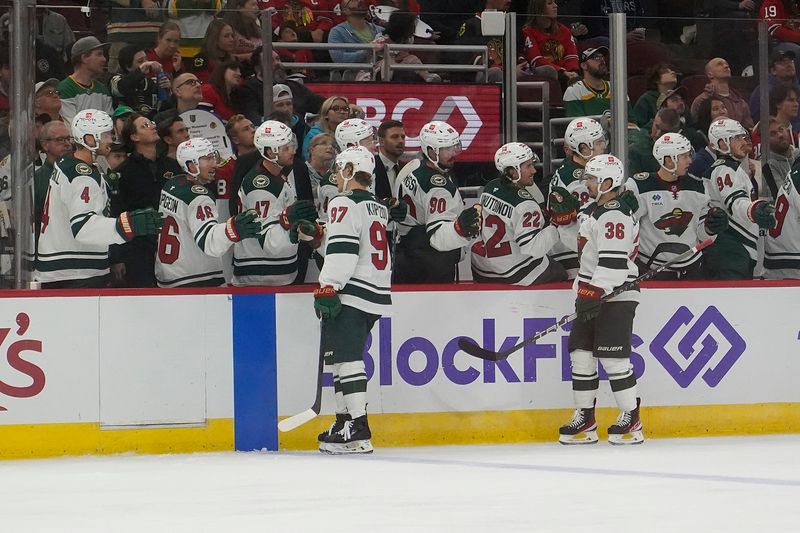 Oct 4, 2024; Chicago, Illinois, USA; Minnesota Wild left wing Kirill Kaprizov (97) celebrates his goal against the Minnesota Wild during the third period at United Center. Mandatory Credit: David Banks-Imagn Images