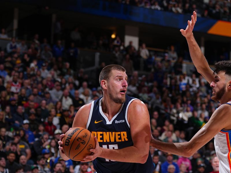 DENVER, CO - NOVEMBER 6: Nikola Jokic #15 of the Denver Nuggets handles the ball during the game against the Oklahoma City Thunder on November 6, 2024 at Ball Arena in Denver, Colorado. NOTE TO USER: User expressly acknowledges and agrees that, by downloading and/or using this Photograph, user is consenting to the terms and conditions of the Getty Images License Agreement. Mandatory Copyright Notice: Copyright 2024 NBAE (Photo by Garrett Ellwood/NBAE via Getty Images)