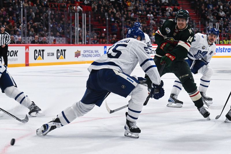 Nov 19, 2023; Stockholm, SWE; Minnesota Wild center Joel Eriksson Ek (14) shoots the puck past Toronto Maple Leafs defenseman Mark Giordano (55) during a Global Series NHL hockey game at Avicii Arena. Mandatory Credit: Per Haljestam-USA TODAY Sports