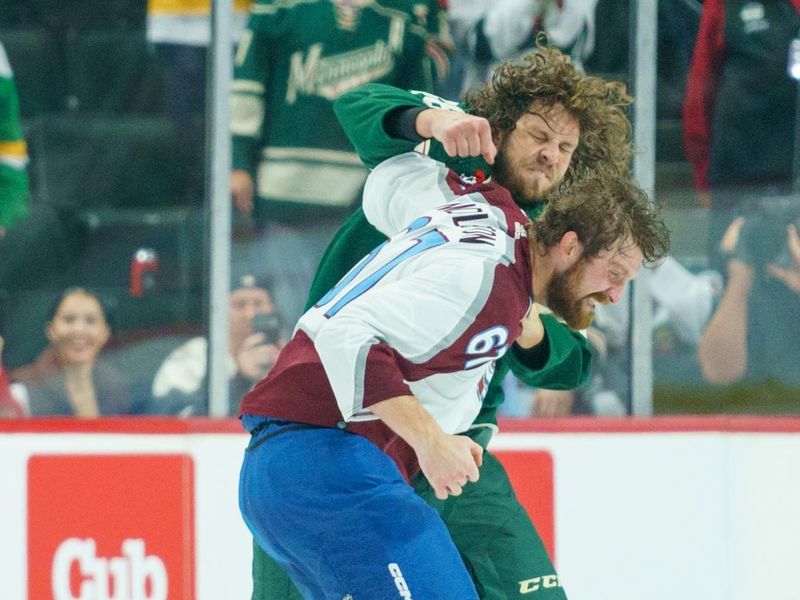 Sep 28, 2023; Saint Paul, Minnesota, USA; Colorado Avalanche defenseman Keaton Middleton (67) and Minnesota Wild left wing Kale Kessy (88) fight in the first period at Xcel Energy Center. Mandatory Credit: Matt Blewett-USA TODAY Sports