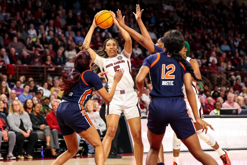 Jan 5, 2023; Columbia, South Carolina, USA; South Carolina Gamecocks forward Victaria Saxton (5) looks to pass over Auburn Tigers forward Mya Pratcher (1) in the first half at Colonial Life Arena. Mandatory Credit: Jeff Blake-USA TODAY Sports