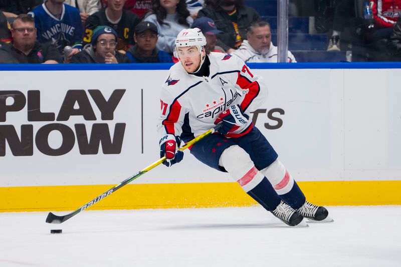 Mar 16, 2024; Vancouver, British Columbia, CAN; Washington Capitals forward TJ Oshie (77) handles the puck against the Vancouver Canucks in the second period at Rogers Arena. Mandatory Credit: Bob Frid-USA TODAY Sports