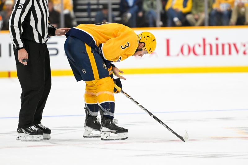 Oct 17, 2024; Nashville, Tennessee, USA;  Nashville Predators defenseman Jeremy Lauzon (3) gets hit in the face and is taken off against the Edmonton Oilers during the second period at Bridgestone Arena. Mandatory Credit: Steve Roberts-Imagn Images