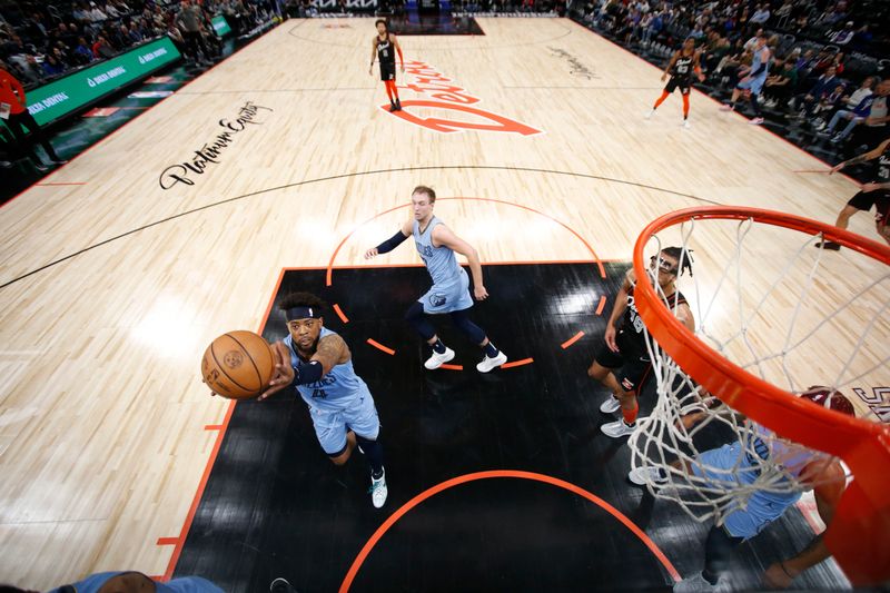 DETROIT, MI - APRIL 1: Jordan Goodwin #4 of the Memphis Grizzlies rebounds the ball during the game against the Detroit Pistons on April 1, 2024 at Little Caesars Arena in Detroit, Michigan. NOTE TO USER: User expressly acknowledges and agrees that, by downloading and/or using this photograph, User is consenting to the terms and conditions of the Getty Images License Agreement. Mandatory Copyright Notice: Copyright 2024 NBAE (Photo by Brian Sevald/NBAE via Getty Images)