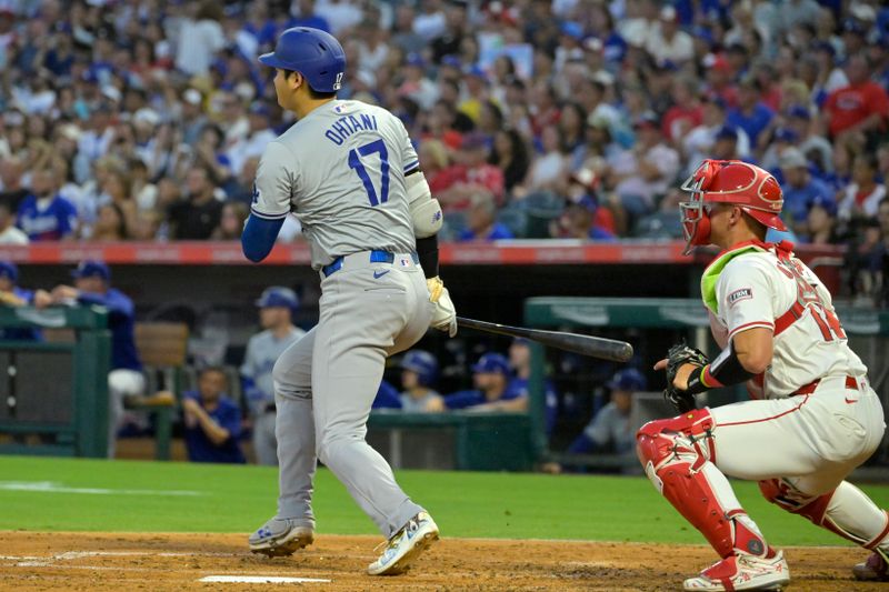 Sep 3, 2024; Anaheim, California, USA;  Los Angeles Dodgers designated hitter Shohei Ohtani (17) hits a triple in the third inning against the Los Angeles Angels at Angel Stadium. Mandatory Credit: Jayne Kamin-Oncea-Imagn Images