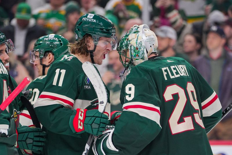 Apr 2, 2024; Saint Paul, Minnesota, USA; Minnesota Wild left wing Adam Beckman (11) celebrates with goaltender Marc-Andre Fleury (29) after the game against the Ottawa Senators at Xcel Energy Center. Mandatory Credit: Brad Rempel-USA TODAY Sports