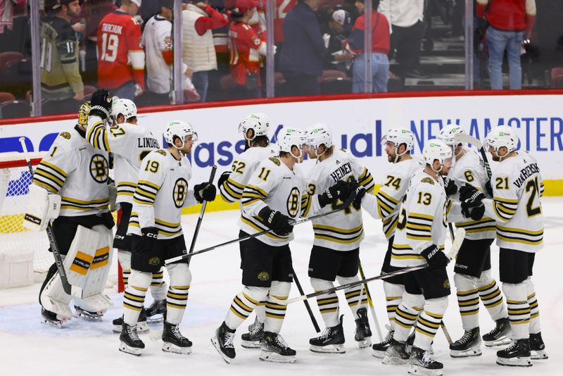 May 14, 2024; Sunrise, Florida, USA; Boston Bruins players celebrate after winning against the Florida Panthers in game five of the second round of the 2024 Stanley Cup Playoffs at Amerant Bank Arena. Mandatory Credit: Sam Navarro-USA TODAY Sports