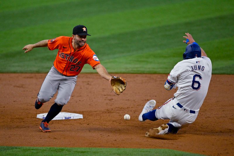 Aug 7, 2024; Arlington, Texas, USA;  Texas Rangers third baseman Josh Jung (6) advances to second base as Houston Astros second baseman Jose Altuve (27) cannot field the throw during the second inning at Globe Life Field. Mandatory Credit: Jerome Miron-USA TODAY Sports