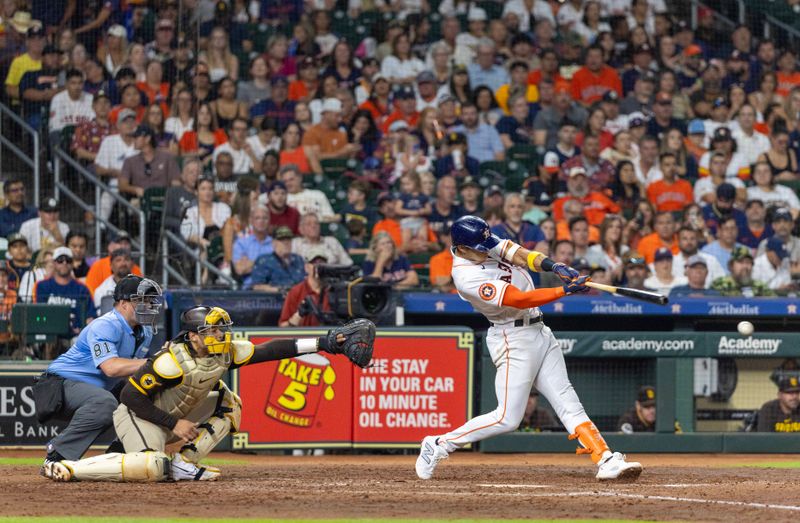 Sep 9, 2023; Houston, Texas, USA; Houston Astros shortstop Jeremy Pena (3) hits a single against the San Diego Padres in the fifth inning at Minute Maid Park. Mandatory Credit: Thomas Shea-USA TODAY Sports