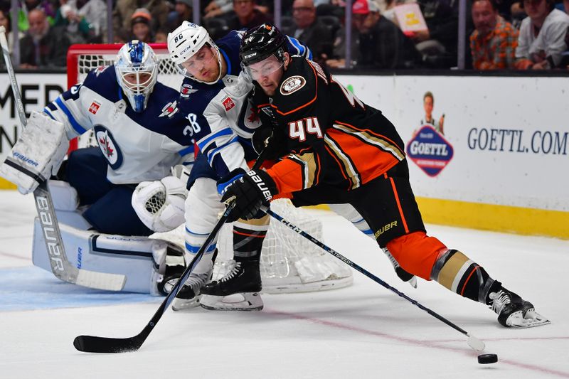 Jan 5, 2024; Anaheim, California, USA; Winnipeg Jets defenseman Nate Schmidt (88) helps goaltender Laurent Brossoit (39) defend the goal agianst Anaheim Ducks left wing Ross Johnston (44) during the second period at Honda Center. Mandatory Credit: Gary A. Vasquez-USA TODAY Sports