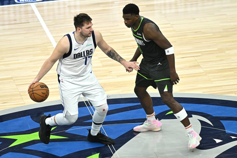 MINNEAPOLIS, MINNESOTA - MAY 30: Luka Doncic #77 of the Dallas Mavericks brings the ball up the court against Anthony Edwards #5 of the Minnesota Timberwolves during the third quarter in Game Five of the Western Conference Finals at Target Center on May 30, 2024 in Minneapolis, Minnesota. NOTE TO USER: User expressly acknowledges and agrees that, by downloading and or using this photograph, User is consenting to the terms and conditions of the Getty Images License Agreement. (Photo by Stephen Maturen/Getty Images)