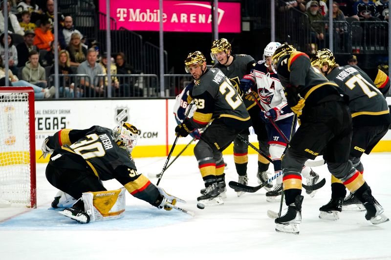 Mar 19, 2023; Las Vegas, Nevada, USA; Vegas Golden Knights goaltender Jiri Patera (30) makes a save against the Columbus Blue Jackets during the first period at T-Mobile Arena. Mandatory Credit: Lucas Peltier-USA TODAY Sports