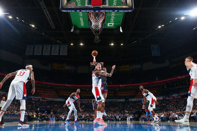 OKLAHOMA CITY, OK - JANUARY 6:  Josh Giddey #3 of the Oklahoma City Thunder drives to the basket during the game against the Washington Wizards on January 6, 2023 at Paycom Arena in Oklahoma City, Oklahoma. NOTE TO USER: User expressly acknowledges and agrees that, by downloading and or using this photograph, User is consenting to the terms and conditions of the Getty Images License Agreement. Mandatory Copyright Notice: Copyright 2023 NBAE (Photo by Zach Beeker/NBAE via Getty Images)