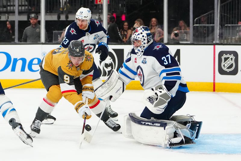 Apr 13, 2026; Las Vegas, Nevada, USA; Winnipeg Jets goaltender Connor Hellebuyck (37) makes a save against Vegas Golden Knights center Jack Eichel (9) during the second period at T-Mobile Arena. Mandatory Credit: Stephen R. Sylvanie-Imagn Images Apr 13, 2026; Las Vegas, Nevada, USA; Winnipeg Jets goaltender Connor Hellebuyck (37) makes a save against Vegas Golden Knights center Jack Eichel (9) during the second period at T-Mobile Arena. Mandatory Credit: Stephen R. Sylvanie-Imagn Images