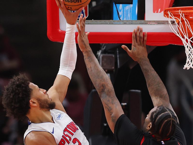 CHICAGO, ILLINOIS - FEBRUARY 27: Cade Cunningham #2 of the Detroit Pistons goes up for a layup against Andre Drummond #3 of the Chicago Bulls during the first half at the United Center on February 27, 2024 in Chicago, Illinois. NOTE TO USER: User expressly acknowledges and agrees that, by downloading and or using this photograph, User is consenting to the terms and conditions of the Getty Images License Agreement. (Photo by Michael Reaves/Getty Images)