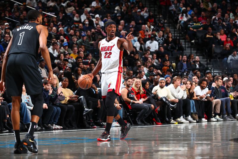 BROOKLYN, NY - JANUARY 15: Jimmy Butler #22 of the Miami Heat dribbles the ball during the game against the Brooklyn Nets on January 15, 2024 at Barclays Center in Brooklyn, New York. NOTE TO USER: User expressly acknowledges and agrees that, by downloading and or using this Photograph, user is consenting to the terms and conditions of the Getty Images License Agreement. Mandatory Copyright Notice: Copyright 2024 NBAE (Photo by David Nemec/NBAE via Getty Images)