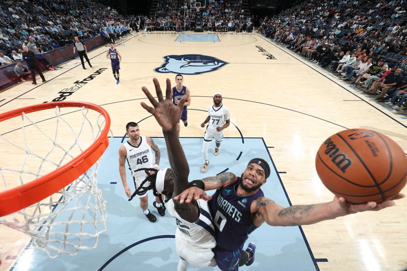 MEMPHIS, TN - MARCH 13: Miles Bridges #0 of the Charlotte Hornets drives to the basket during the game against the Memphis Grizzlies on March 13, 2024 at FedExForum in Memphis, Tennessee. NOTE TO USER: User expressly acknowledges and agrees that, by downloading and or using this photograph, User is consenting to the terms and conditions of the Getty Images License Agreement. Mandatory Copyright Notice: Copyright 2024 NBAE (Photo by Joe Murphy/NBAE via Getty Images)