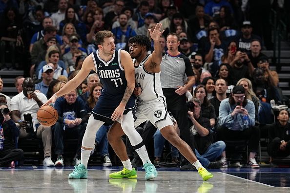 DALLAS, TX - OCTOBER 27: Cam Thomas #24 of the Brooklyn Nets plays defense against Luka Doncic #77 of the Dallas Mavericks on October 27, 2023 at the American Airlines Center in Dallas, Texas. NOTE TO USER: User expressly acknowledges and agrees that, by downloading and or using this photograph, User is consenting to the terms and conditions of the Getty Images License Agreement. Mandatory Copyright Notice: Copyright 2023 NBAE (Photo by Glenn James/NBAE via Getty Images)