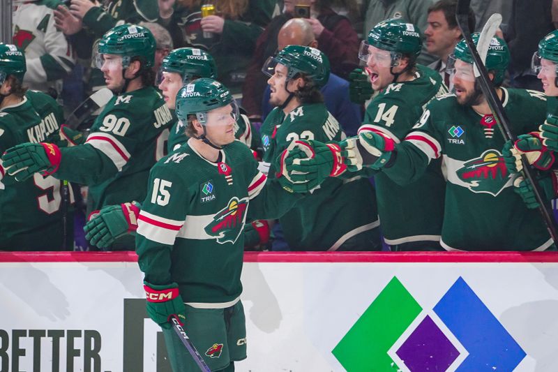 Apr 2, 2024; Saint Paul, Minnesota, USA; Minnesota Wild center Mason Shaw (15) scores his first goal of the season against the Ottawa Senators in the first period at Xcel Energy Center. Mandatory Credit: Brad Rempel-USA TODAY Sports