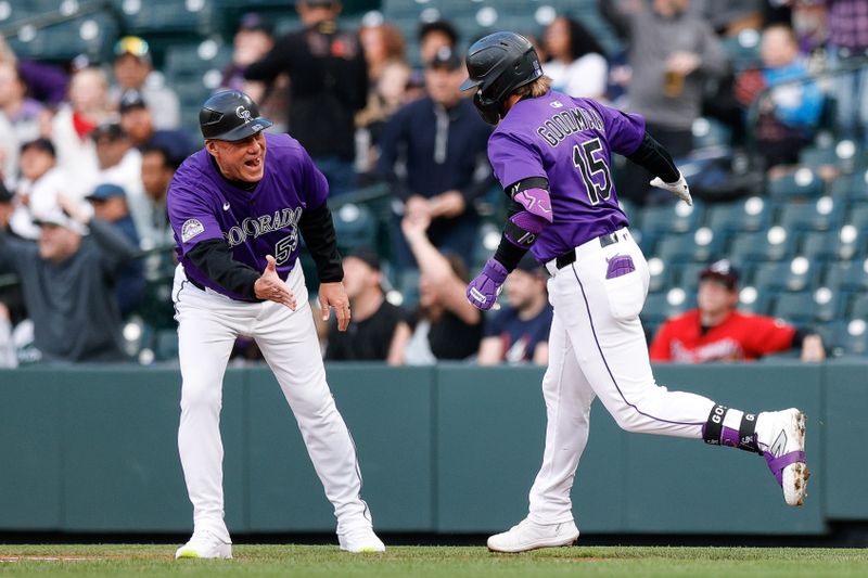 Apr 28, 2025; Denver, Colorado, USA; Colorado Rockies designated hitter Hunter Goodman (15) celebrates with first base coach Ronnie Gideon (53) on a three run home run in the first inning against the Atlanta Braves at Coors Field. Mandatory Credit: Isaiah J. Downing-Imagn Images