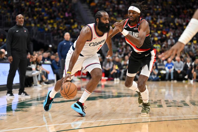 SEATTLE, WASHINGTON - OCTOBER 11: James Harden #1 of the LA Clippers dribbles against Jerami Grant #9 of the Portland Trail Blazers during the first quarter of the Rain City Showcase game at Climate Pledge Arena on October 11, 2024 in Seattle, Washington. The LA Clippers won 101-99. NOTE TO USER: User expressly acknowledges and agrees that, by downloading and or using this photograph, User is consenting to the terms and conditions of the Getty Images License Agreement. (Photo by Alika Jenner/Getty Images)