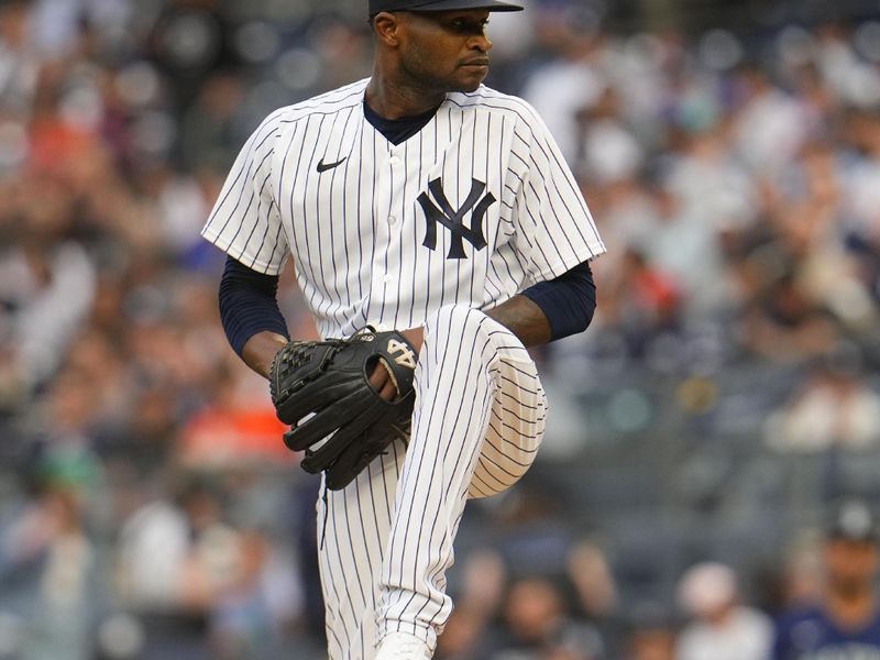 Jun 22, 2023; Bronx, New York, USA; New York Yankees pitcher Domingo German (0) delivers a pitch against the Seattle Mariners during the first inning at Yankee Stadium. Mandatory Credit: Gregory Fisher-USA TODAY Sports