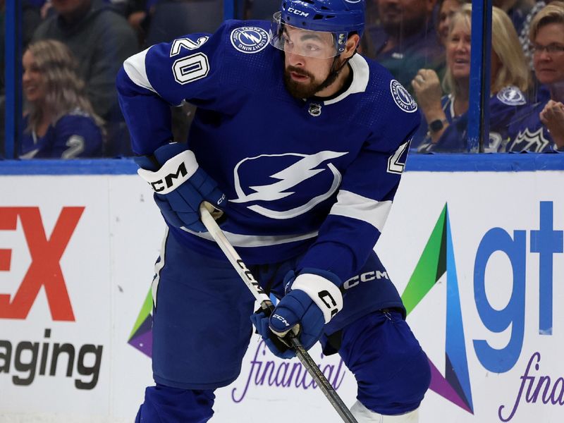 Oct 26, 2023; Tampa, Florida, USA; Tampa Bay Lightning left wing Nicholas Paul (20) skates with the puck against the San Jose Sharks during the first period at Amalie Arena. Mandatory Credit: Kim Klement Neitzel-USA TODAY Sports