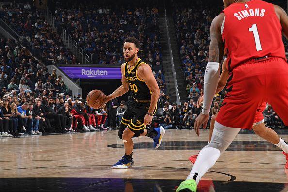 SAN FRANCISCO, CA - DECEMBER 23: Stephen Curry #30 of the Golden State Warriors dribbles the ball during the game against the Portland Trail Blazers on December 23, 2023 at Chase Center in San Francisco, California. NOTE TO USER: User expressly acknowledges and agrees that, by downloading and or using this photograph, user is consenting to the terms and conditions of Getty Images License Agreement. Mandatory Copyright Notice: Copyright 2023 NBAE (Photo by Noah Graham/NBAE via Getty Images)