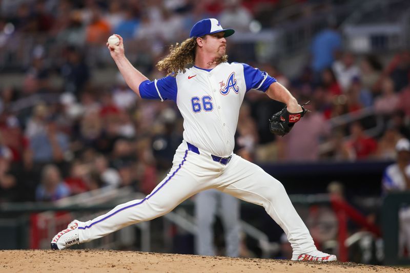 Aug 24, 2024; Atlanta, Georgia, USA; Atlanta Braves relief pitcher Grant Holmes (66) throws against the Washington Nationals in the eighth inning at Truist Park. Mandatory Credit: Brett Davis-USA TODAY Sports