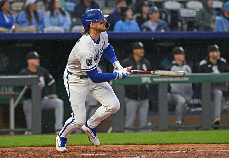 May 7, 2025; Kansas City, Missouri, USA;  Kansas City Royals shortstop Bobby Witt Jr. (7) hits a two-run home run in the fifth inning against the Chicago White Sox at Kauffman Stadium. Mandatory Credit: Peter Aiken-Imagn Images