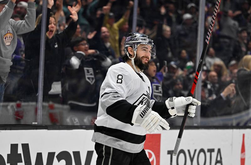 Apr 10, 2023; Los Angeles, California, USA;  Los Angeles Kings defenseman Drew Doughty (8) smiles after scoring an empty net goal from the opposite end of the ice in the third period against the Vancouver Canucks at Crypto.com Arena. Mandatory Credit: Jayne Kamin-Oncea-USA TODAY Sports