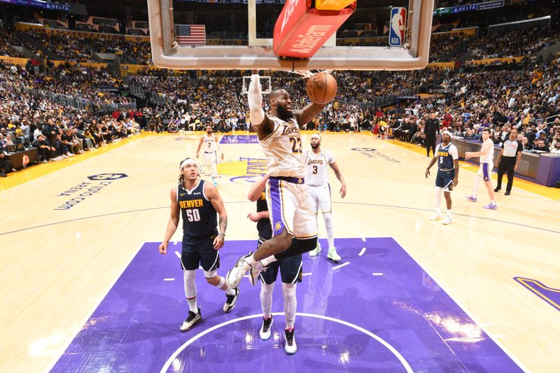 LOS ANGELES, CA - APRIL 27: LeBron James #23 of the Los Angeles Lakers dunks the ball during the game against the Denver Nuggets during Round 1 Game 4 of the 2024 NBA Playoffs on April 27, 2024 at Crypto.Com Arena in Los Angeles, California. NOTE TO USER: User expressly acknowledges and agrees that, by downloading and/or using this Photograph, user is consenting to the terms and conditions of the Getty Images License Agreement. Mandatory Copyright Notice: Copyright 2024 NBAE (Photo by Andrew D. Bernstein/NBAE via Getty Images)