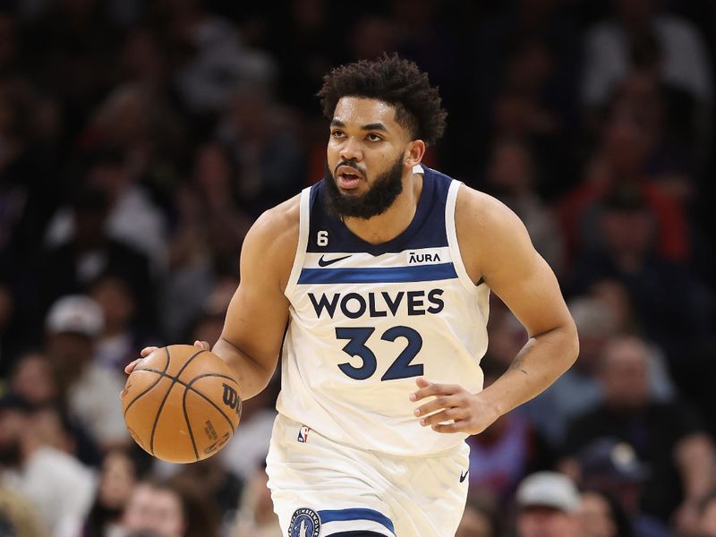 PHOENIX, ARIZONA - MARCH 29: Karl-Anthony Towns #32 of the Minnesota Timberwolves handles the ball during the first half of the NBA game against the Phoenix Suns at Footprint Center on March 29, 2023 in Phoenix, Arizona. The Suns defeated the Timberwolves 107-100.  NOTE TO USER: User expressly acknowledges and agrees that, by downloading and or using this photograph, User is consenting to the terms and conditions of the Getty Images License Agreement.  (Photo by Christian Petersen/Getty Images)