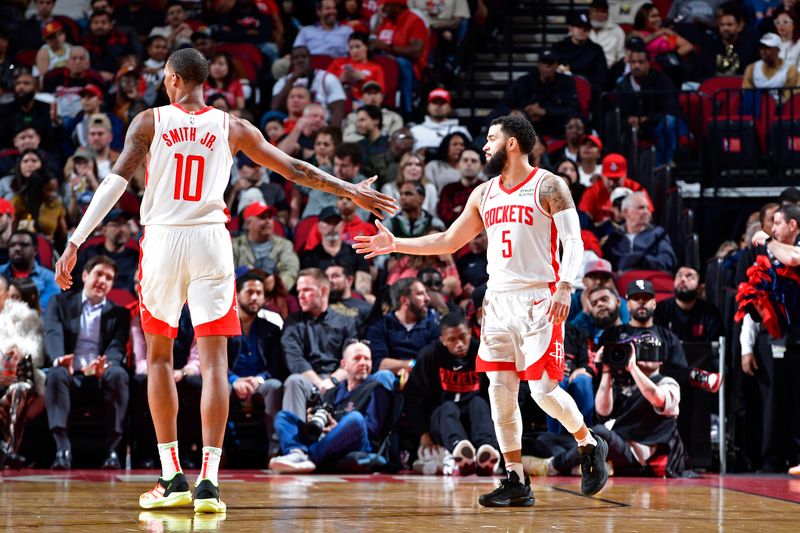 HOUSTON, TX - JANUARY 31:  Jabari Smith Jr. #10 and Fred VanVleet #5 of the Houston Rockets high five during the game against the New Orleans Pelicans on January 31, 2024 at the Toyota Center in Houston, Texas. NOTE TO USER: User expressly acknowledges and agrees that, by downloading and or using this photograph, User is consenting to the terms and conditions of the Getty Images License Agreement. Mandatory Copyright Notice: Copyright 2024 NBAE (Photo by Logan Riely/NBAE via Getty Images)